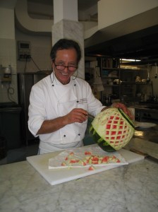 Chef Domenico Cuomo carving a watermelon